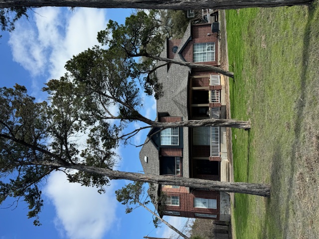 Brick home roofing project before and after